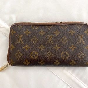 Louis Vuitton wallet with check book flap.